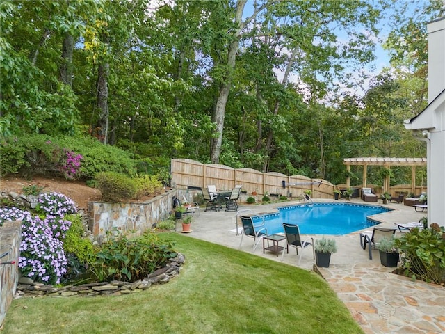 view of pool featuring a fenced in pool, fence, a pergola, and a patio area