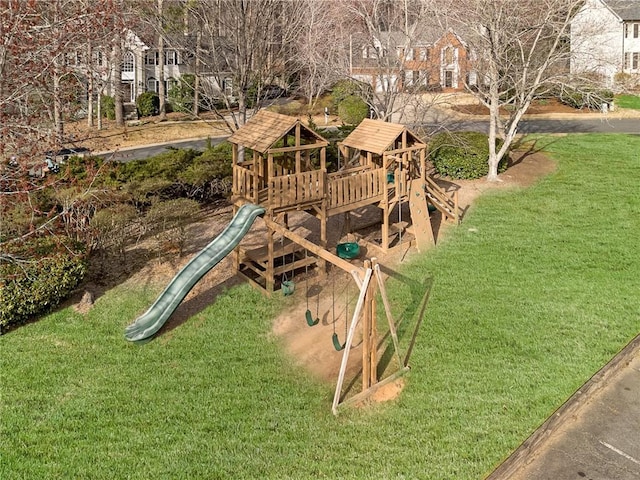 view of playground with a lawn