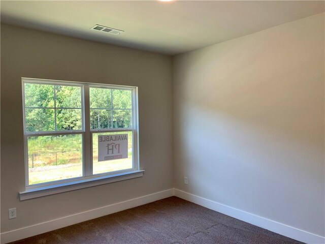 empty room featuring carpet floors