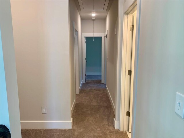 corridor featuring carpet flooring