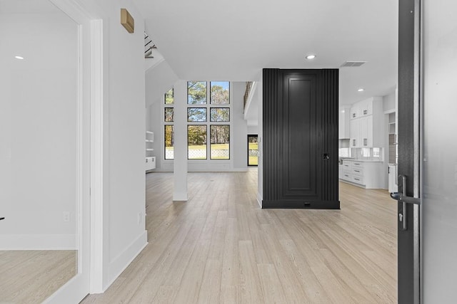 entryway with light hardwood / wood-style floors