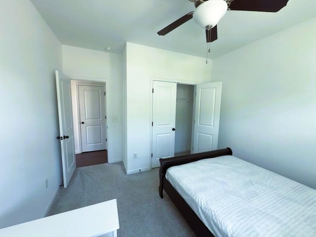 4935 Bellehurst Ln, Cumming, GA 30040 - carpeted bedroom with a closet, ceiling fan, and baseboards
