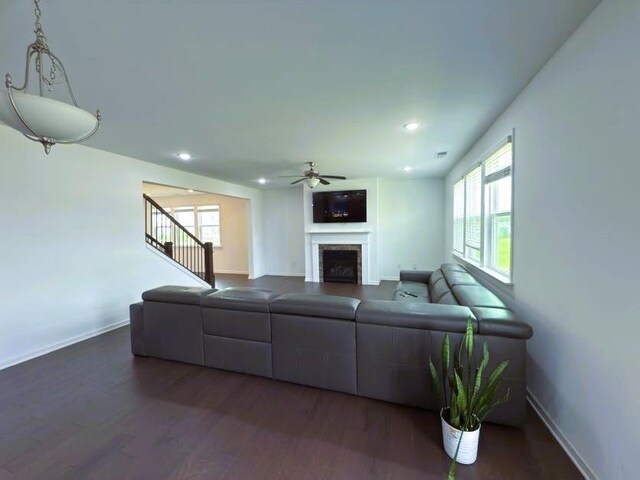 4935 Bellehurst Ln, Cumming, GA 30040 - living area with a ceiling fan, dark wood-type flooring, a fireplace, baseboards, and recessed lighting