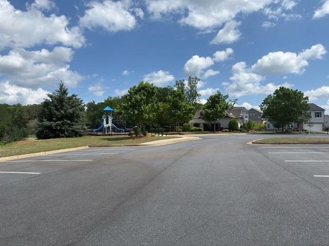 4935 Bellehurst Ln, Cumming, GA 30040 - view of asphalt road with curbs and a residential view