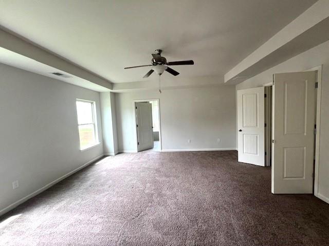 2469 Osceola Rd, Lithonia, GA 30058 - spare room with a ceiling fan, baseboards, and carpet flooring
