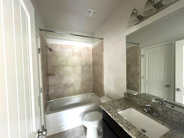 2469 Osceola Rd, Lithonia, GA 30058 - bathroom featuring toilet, shower / washtub combination, and vanity