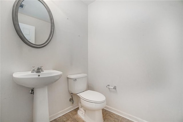 7761 Parkside Dr, Lithia Springs, GA 30122 - bathroom featuring toilet and baseboards