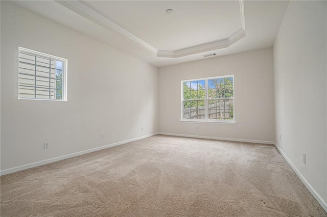 7761 Parkside Dr, Lithia Springs, GA 30122 - carpeted empty room with crown molding, a tray ceiling, and baseboards