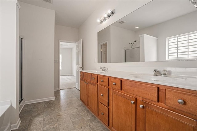 7761 Parkside Dr, Lithia Springs, GA 30122 - full bathroom featuring a shower with shower door, double vanity, and baseboards