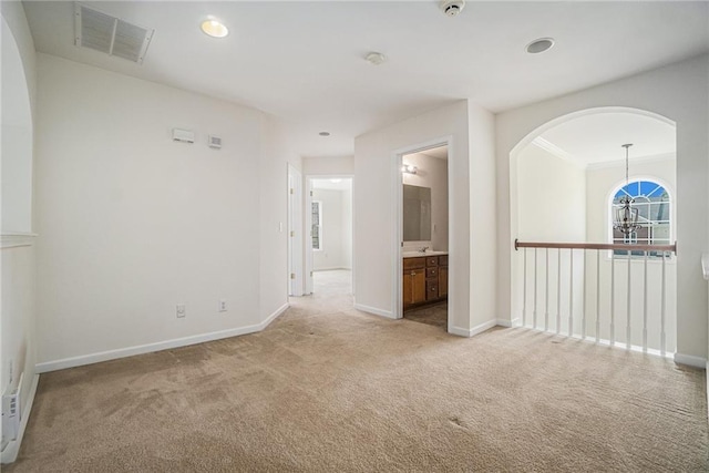 7761 Parkside Dr, Lithia Springs, GA 30122 - empty room featuring carpet, baseboards, arched walkways, and recessed lighting