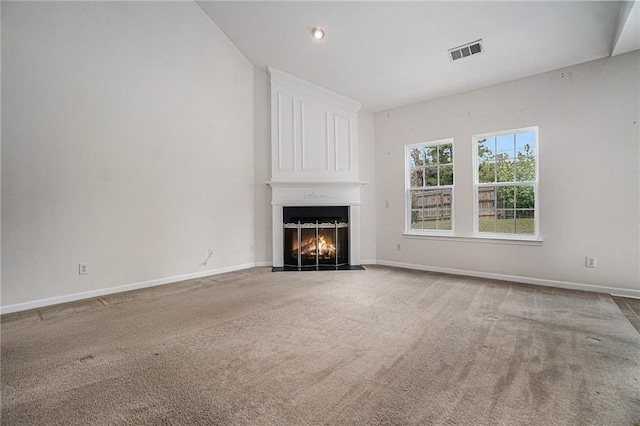 7761 Parkside Dr, Lithia Springs, GA 30122 - unfurnished living room featuring a fireplace, carpet, baseboards, and recessed lighting