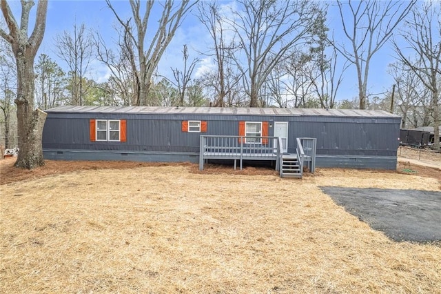 manufactured / mobile home with crawl space and a deck