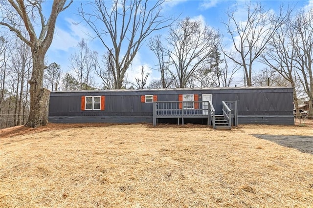 manufactured / mobile home with crawl space and a wooden deck