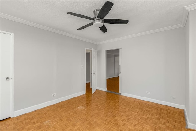 unfurnished bedroom with a textured ceiling, a ceiling fan, baseboards, and ornamental molding