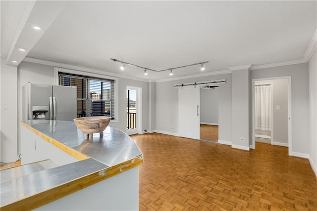 interior space with crown molding, baseboards, stainless steel counters, recessed lighting, and stainless steel refrigerator with ice dispenser