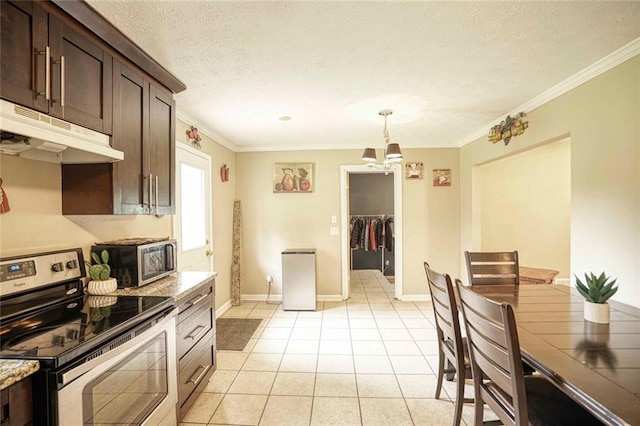 kitchen featuring stainless steel appliances, light stone counters, crown molding, dark brown cabinets, and light tile patterned flooring