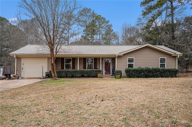 single story home featuring a garage, driveway, a front lawn, and metal roof