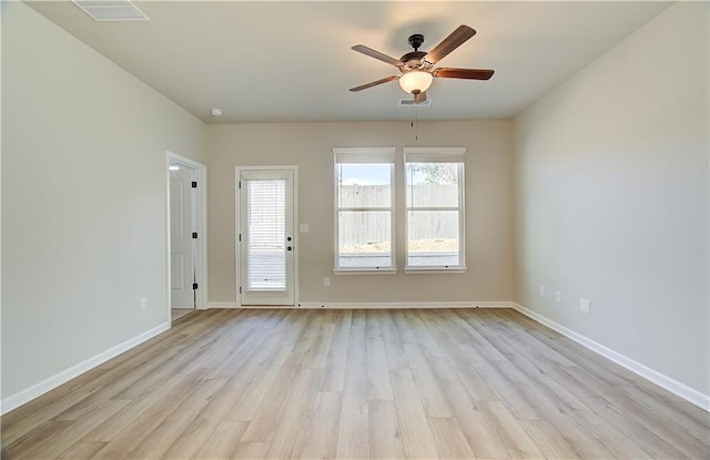 empty room featuring light hardwood / wood-style flooring and ceiling fan