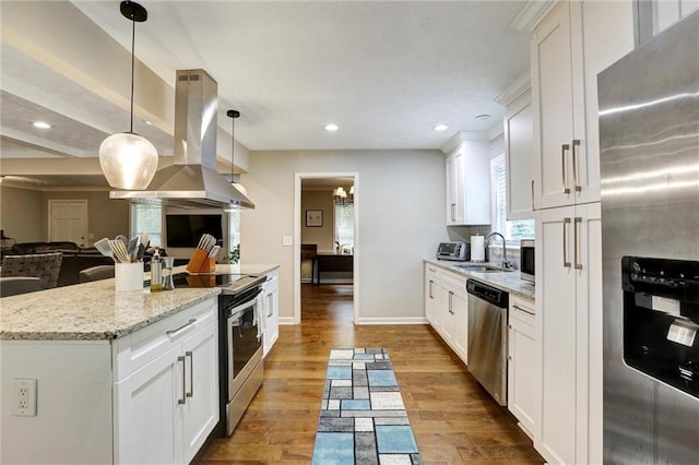 537 Raven Springs Trl, Stone Mountain, GA 30087 - kitchen featuring stainless steel appliances, island range hood, open floor plan, white cabinetry, and recessed lighting