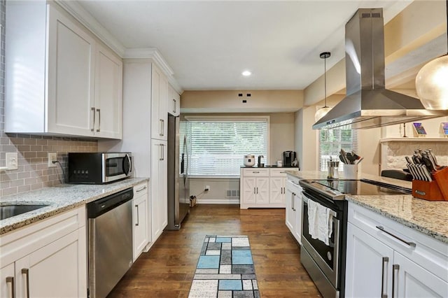 537 Raven Springs Trl, Stone Mountain, GA 30087 - kitchen with island range hood, appliances with stainless steel finishes, white cabinetry, dark wood finished floors, and recessed lighting