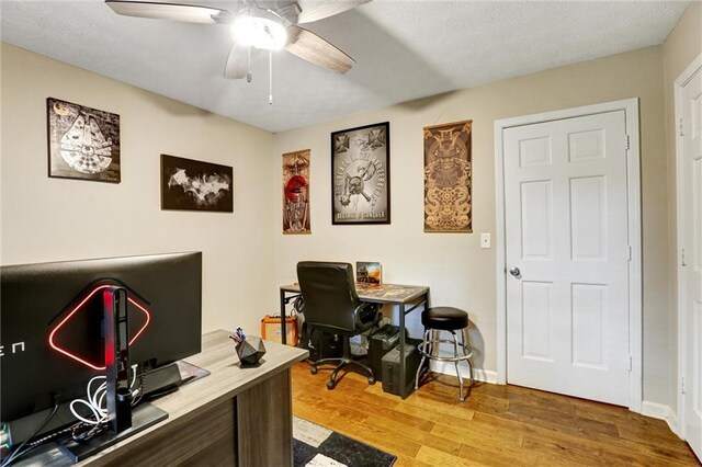 537 Raven Springs Trl, Stone Mountain, GA 30087 - office with a ceiling fan and wood finished floors