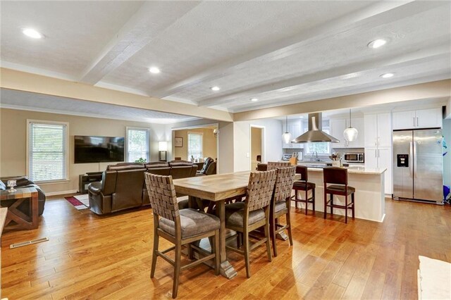 537 Raven Springs Trl, Stone Mountain, GA 30087 - dining room featuring light wood-style floors, beamed ceiling, and recessed lighting