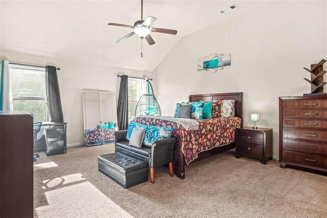 carpeted bedroom featuring ceiling fan and lofted ceiling