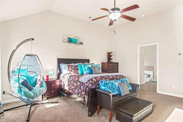 bedroom with carpet, ceiling fan, connected bathroom, and vaulted ceiling