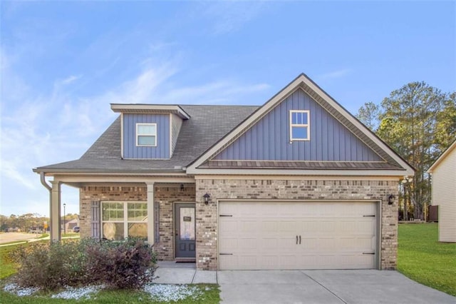 craftsman-style home featuring a front yard and a garage