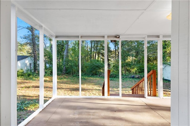 unfurnished sunroom with a wealth of natural light