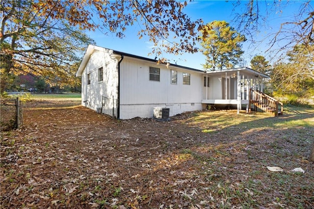 exterior space featuring crawl space and central air condition unit