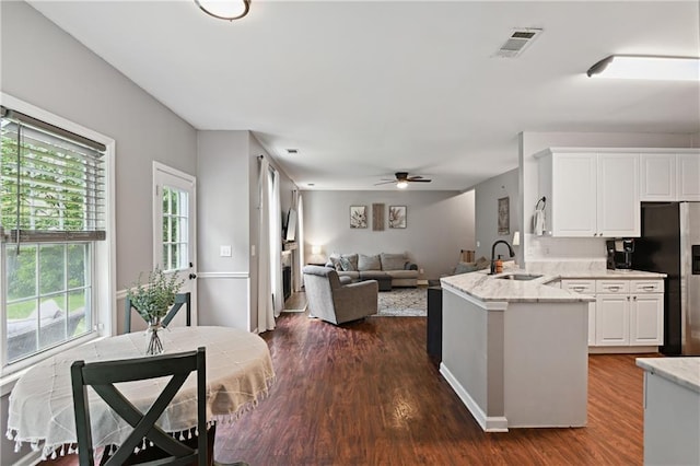 1185 Charter Club Dr, Lawrenceville, GA 30043 - kitchen featuring a sink, a ceiling fan, white cabinets, and dark wood-style floors