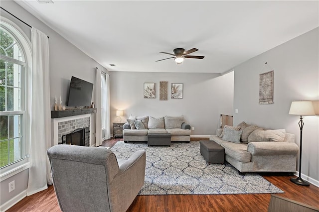 1185 Charter Club Dr, Lawrenceville, GA 30043 - living room featuring ceiling fan, a brick fireplace, wood finished floors, and baseboards