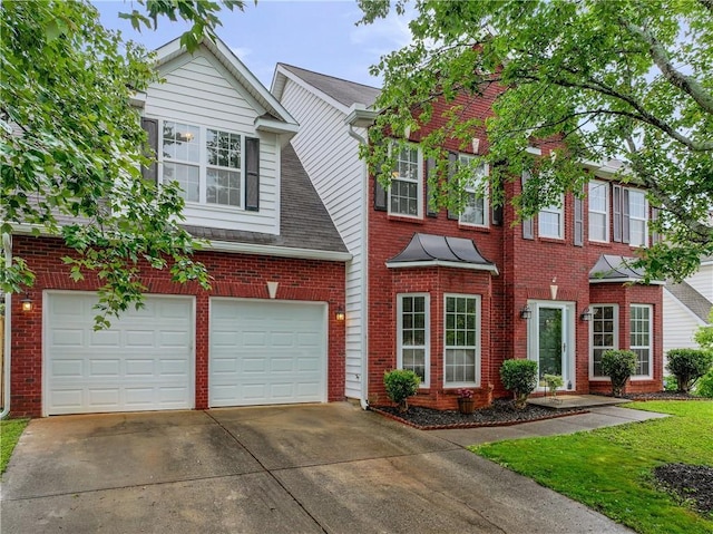 1185 Charter Club Dr, Lawrenceville, GA 30043 - view of front of property featuring concrete driveway, an attached garage, and brick siding