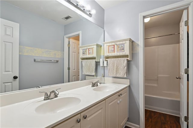 1185 Charter Club Dr, Lawrenceville, GA 30043 - full bathroom with double vanity, bathing tub / shower combination, and wood finished floors