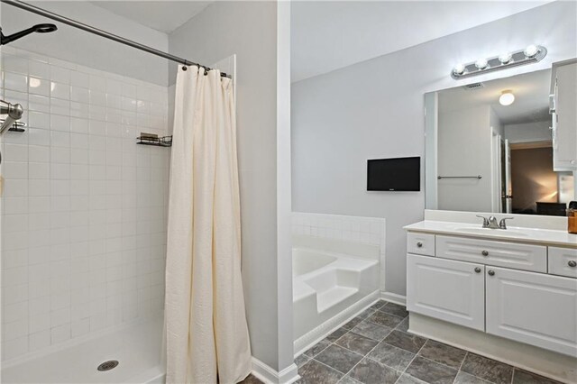 1185 Charter Club Dr, Lawrenceville, GA 30043 - bathroom featuring vanity, a bath, tiled shower, and baseboards
