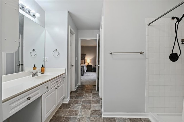 1185 Charter Club Dr, Lawrenceville, GA 30043 - ensuite bathroom with vanity, tiled shower, stone finish flooring, and baseboards