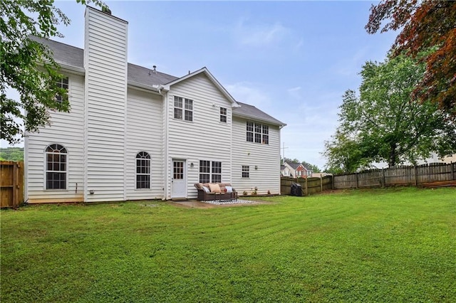 1185 Charter Club Dr, Lawrenceville, GA 30043 - rear view of property with a chimney, outdoor lounge area, and a patio