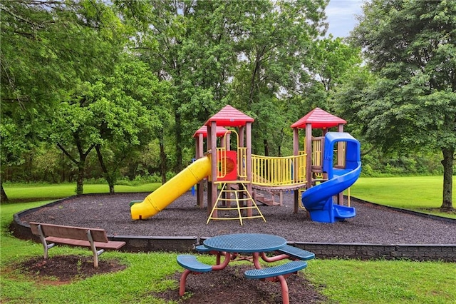 1185 Charter Club Dr, Lawrenceville, GA 30043 - community playground featuring a lawn and view of wooded area