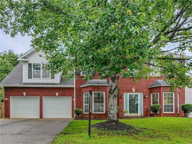 1185 Charter Club Dr, Lawrenceville, GA 30043 - view of front of home featuring a garage, asphalt driveway, a front lawn, and brick siding