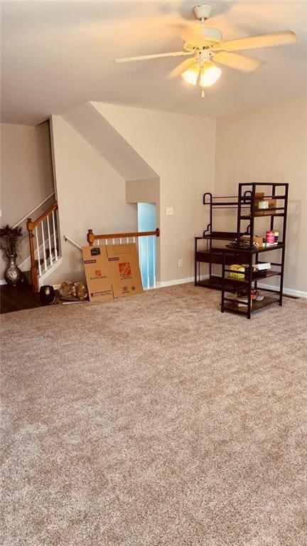 bedroom with ceiling fan, vaulted ceiling, and carpet floors