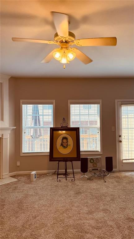 unfurnished room featuring carpet flooring and ceiling fan