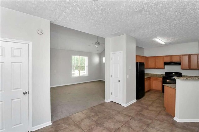 kitchen with a textured ceiling, black appliances, ceiling fan, and light colored carpet