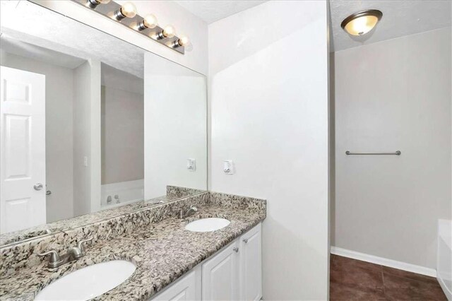 bathroom with vanity and tile patterned flooring