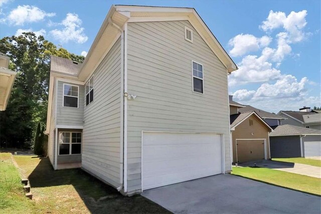 view of property exterior with a yard