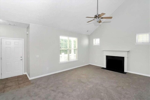 unfurnished living room featuring ceiling fan, carpet, and high vaulted ceiling