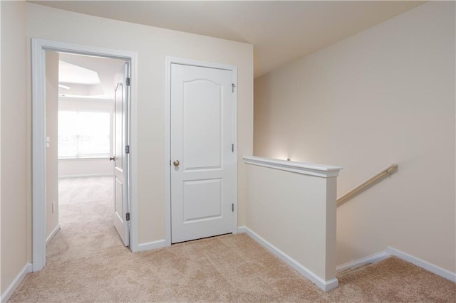 529 Ridge View Xing, Woodstock, GA 30188 - corridor with light carpet, an upstairs landing, and baseboards