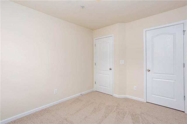 529 Ridge View Xing, Woodstock, GA 30188 - unfurnished bedroom with baseboards and carpet