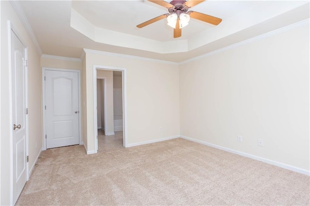 529 Ridge View Xing, Woodstock, GA 30188 - unfurnished bedroom with light colored carpet, a tray ceiling, ornamental molding, baseboards, and ceiling fan