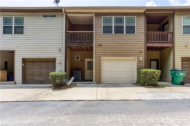 529 Ridge View Xing, Woodstock, GA 30188 - view of building exterior featuring a garage, central AC unit, and driveway